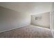 Neutral bedroom with carpet, a large window providing ample natural light, and a closet for storage at 1043 Lilac Ct, Broomfield, CO 80020