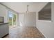 Bright and spacious kitchen area with tile flooring, stainless steel appliances, and a sliding glass door at 1043 Lilac Ct, Broomfield, CO 80020