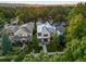 Aerial view of the neighborhood and updated house featuring a well-manicured lawn at 2475 S Saint Paul St, Denver, CO 80210