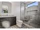 A stylish bathroom with a marble vanity top and a glass enclosed walk-in shower at 2475 S Saint Paul St, Denver, CO 80210