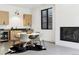 Modern dining area with a fireplace, an area rug, and lots of natural lighting at 2475 S Saint Paul St, Denver, CO 80210