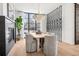 Chic dining room featuring a modern light fixture, fireplace, and floor to ceiling windows at 2475 S Saint Paul St, Denver, CO 80210