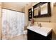 Well-lit bathroom features a vanity with a dark wood cabinet and a shower-tub combination at 1507 Dawson Butte Way, Castle Rock, CO 80109