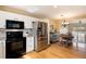 Spacious kitchen area adjacent to dining space, featuring modern appliances at 1507 Dawson Butte Way, Castle Rock, CO 80109