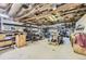 Spacious garage with exposed ceiling beams, ideal for storage or workshop projects at 10040 W 13Th Pl, Lakewood, CO 80215