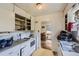 Bright kitchen featuring classic white appliances and cabinetry, complemented by an adjacent dining area at 10040 W 13Th Pl, Lakewood, CO 80215