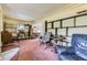 Cozy living room with vintage shelving and an open layout that offers flexible decorating options at 10040 W 13Th Pl, Lakewood, CO 80215
