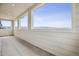 Enclosed balcony with tile flooring and panoramic views of the surrounding landscape at 8245 Butte Creek St, Littleton, CO 80125