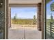 Covered patio with stone columns offers picturesque mountain views at 8245 Butte Creek St, Littleton, CO 80125
