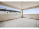 Enclosed patio features tile flooring and large windows with neighborhood views at 8245 Butte Creek St, Littleton, CO 80125
