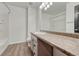 A clean bathroom featuring a light countertop and ample mirror space creates a bright, functional area at 17271 Waterhouse Cir # A, Parker, CO 80134