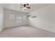 Bright bedroom with natural light, ceiling fan, and floating shelves offers a comfortable and modern space at 17271 Waterhouse Cir # A, Parker, CO 80134