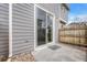 Private patio area with sliding glass door and concrete base, perfect for relaxing outdoors at 17271 Waterhouse Cir # A, Parker, CO 80134