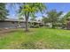 Lush, well-maintained backyard provides a serene retreat with mature trees and ample space for outdoor activities at 3163 S Boston Ct, Denver, CO 80231