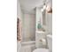 Cozy bathroom featuring a tiled stand-up shower, sink and toilet at 3163 S Boston Ct, Denver, CO 80231