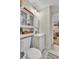 Bathroom features a toilet and vanity sink with access to the bedroom at 3163 S Boston Ct, Denver, CO 80231