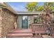 Inviting front porch featuring a cozy entrance and stylish brick accents on the exterior at 3163 S Boston Ct, Denver, CO 80231