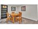 Fun game room area featuring a wooden game table with seating and a built-in bookshelf at 3163 S Boston Ct, Denver, CO 80231