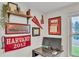 Home office featuring a desk, Harvard décor, natural light from the window, and built-in shelving at 3163 S Boston Ct, Denver, CO 80231