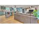 Open-concept living area seamlessly combines the kitchen and living room, creating a spacious and inviting atmosphere at 3163 S Boston Ct, Denver, CO 80231