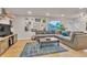 Spacious living room with a comfortable sofa, stylish decor, hardwood floors and lots of natural light at 3163 S Boston Ct, Denver, CO 80231