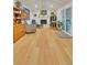 Living room with light wood floors, fireplace, art and access to the outdoors at 3163 S Boston Ct, Denver, CO 80231