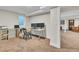 Home office space with natural light, desk, shelving, and neutral carpet at 3163 S Boston Ct, Denver, CO 80231