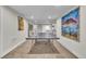 Spacious recreation room featuring a ping pong table, carpeting and colorful paintings on the wall at 3163 S Boston Ct, Denver, CO 80231