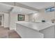 Modern basement wet bar featuring white countertops, sink, and stainless faucet for entertainment at 3163 S Boston Ct, Denver, CO 80231