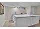 Basement wet bar with modern white countertops, sink, and stainless faucet, ready for entertaining at 3163 S Boston Ct, Denver, CO 80231