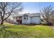 Charming single-story home with a well-maintained front yard and covered porch at 5990 W 8Th Ave, Lakewood, CO 80214