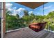 Relaxing balcony view showcasing a hanging swing and trees at 2758 W 22Nd Ave, Denver, CO 80211