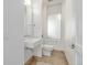 Powder room with modern fixtures, tile floors, and a window at 2758 W 22Nd Ave, Denver, CO 80211
