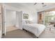 A sunlit bedroom featuring a ceiling fan and access to a private outdoor balcony at 2758 W 22Nd Ave, Denver, CO 80211