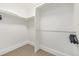 Spacious walk-in closet featuring ample shelving and hanging space for organized storage solutions at 2758 W 22Nd Ave, Denver, CO 80211