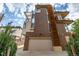 Striking modern townhome with a brick facade, a large garage, and multiple balconies and a low maintenance yard at 2758 W 22Nd Ave, Denver, CO 80211