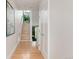 Bright hallway with hardwood floors, creating an inviting transition between living spaces at 2758 W 22Nd Ave, Denver, CO 80211