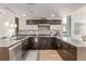 Well-appointed kitchen with stainless steel appliances, tile backsplash, and spacious countertops at 2758 W 22Nd Ave, Denver, CO 80211