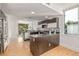Open kitchen showcases stainless steel appliances, sleek cabinetry, and breakfast bar at 2758 W 22Nd Ave, Denver, CO 80211