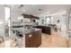 Stylish kitchen featuring stainless steel appliances, dark cabinetry, and breakfast bar at 2758 W 22Nd Ave, Denver, CO 80211