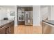 Modern kitchen features stainless steel appliances, wood cabinets, and a breakfast bar at 2758 W 22Nd Ave, Denver, CO 80211