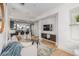 Open-concept living room with seamless flow to the modern kitchen and breakfast bar at 2758 W 22Nd Ave, Denver, CO 80211