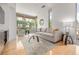 Bright living room with hardwood floors, large windows offering plenty of natural light at 2758 W 22Nd Ave, Denver, CO 80211