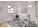 Bright office space features designer flooring, modern lighting, and a large window with exterior views at 2758 W 22Nd Ave, Denver, CO 80211