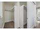 Spacious walk-in closet with ample shelving and hanging space, providing a streamlined storage solution at 2758 W 22Nd Ave, Denver, CO 80211