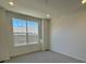 Bright office space with large window and neutral carpet at 5127 N Quemoy St, Aurora, CO 80019