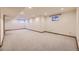 Large finished basement with carpeted floors and single window at 223 Durham Ct, Castle Pines, CO 80108