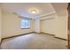 Empty carpeted bedroom with a window at 223 Durham Ct, Castle Pines, CO 80108