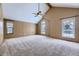 Large bedroom with vaulted ceiling, carpet, and multiple windows at 223 Durham Ct, Castle Pines, CO 80108