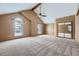 Spacious bedroom with vaulted ceiling, carpet, and mirrored closet at 223 Durham Ct, Castle Pines, CO 80108